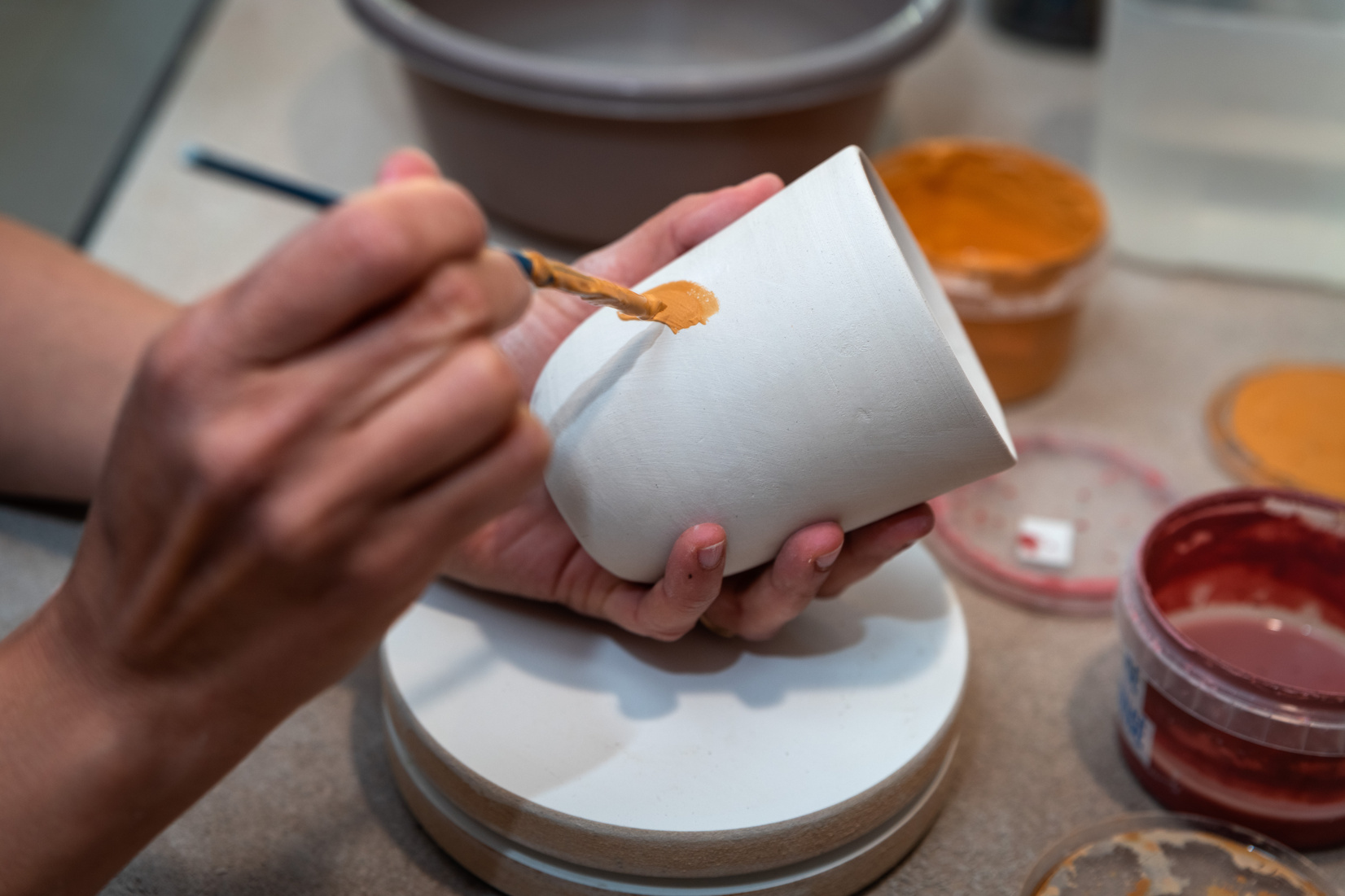Pottery. Painting pottery.
